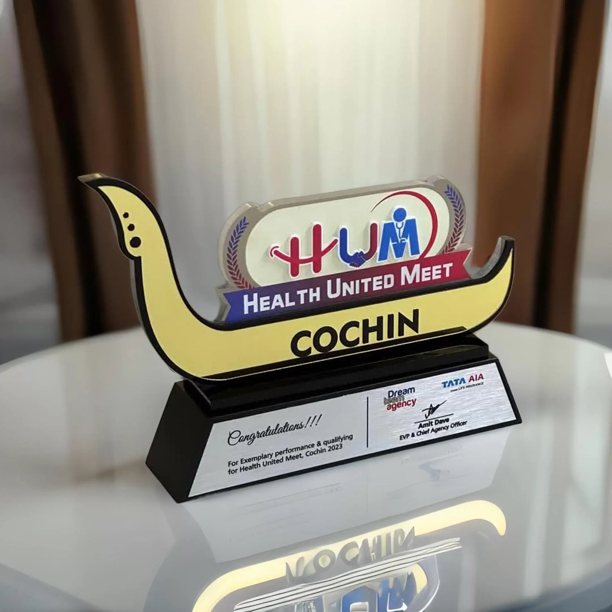 Traditional Cochin boat trophy with cultural design 